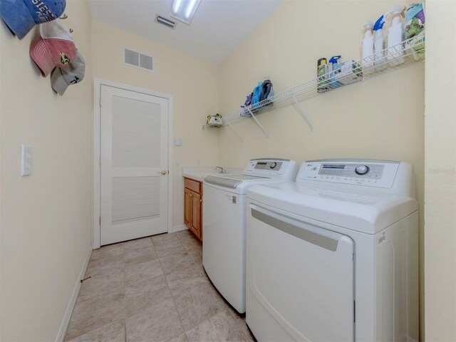 673 Crane Prairie Way, Osprey, FL 34229 - laundry room featuring cabinet space and separate washer and dryer