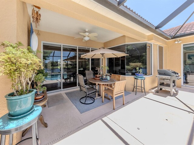 673 Crane Prairie Way, Osprey, FL 34229 - view of patio featuring grilling area, ceiling fan, and outdoor dining space