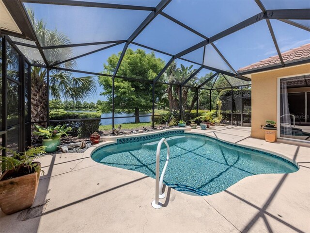 673 Crane Prairie Way, Osprey, FL 34229 - outdoor pool with a patio area, a water view, and glass enclosure
