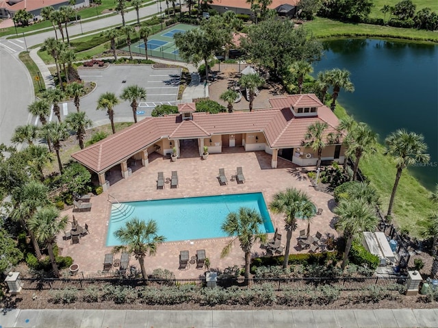 673 Crane Prairie Way, Osprey, FL 34229 - community pool featuring a water view and a patio