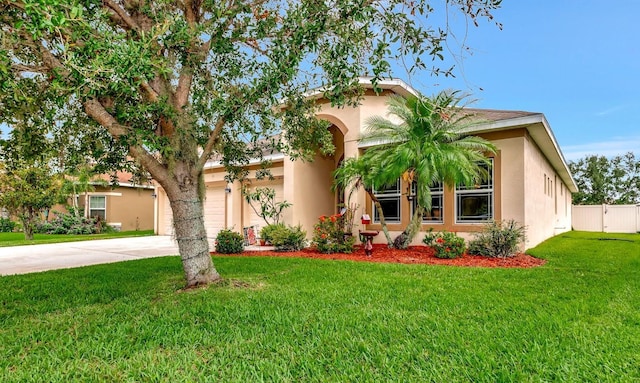 11324 77th St E, Parrish, FL 34219 - view of front of home with driveway, stucco siding, and a garage
