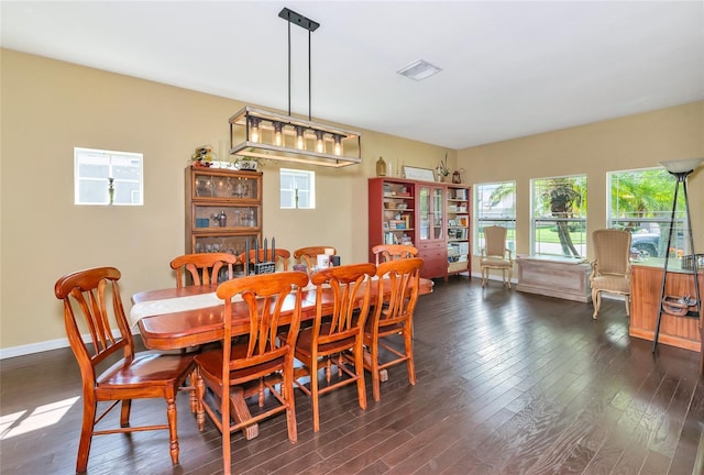 11324 77th St E, Parrish, FL 34219 - dining room featuring dark wood finished floors and baseboards