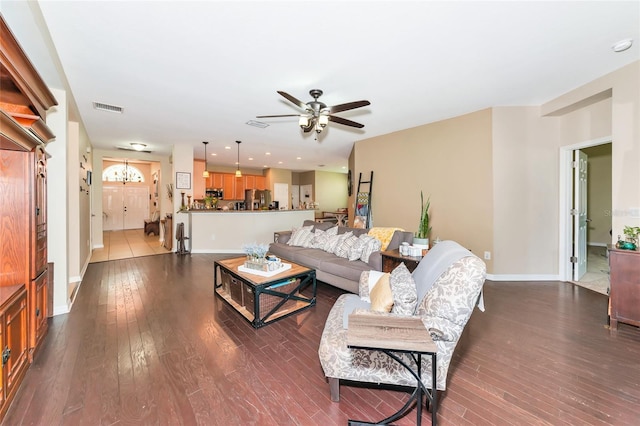 11324 77th St E, Parrish, FL 34219 - living room with ceiling fan, dark wood-type flooring, a chandelier, and recessed lighting