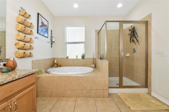 11324 77th St E, Parrish, FL 34219 - full bath featuring a garden tub, a shower stall, tile patterned flooring, vanity, and recessed lighting