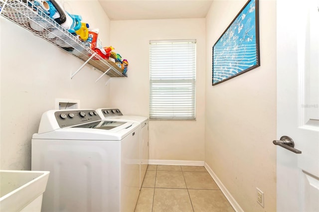 11324 77th St E, Parrish, FL 34219 - laundry room featuring washing machine and clothes dryer and light tile patterned floors