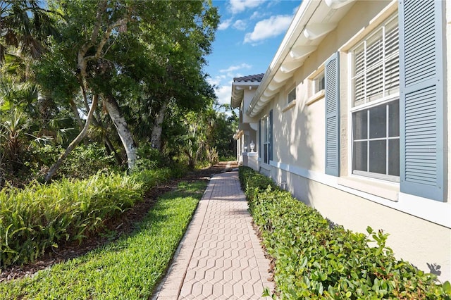 5018 Hanging Moss Ln, Sarasota, FL 34238 - view of home's exterior with stucco siding