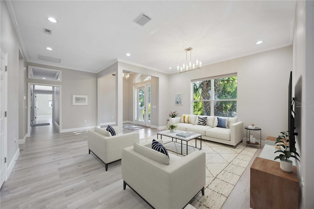 5018 Hanging Moss Ln, Sarasota, FL 34238 - living room featuring light wood-type flooring, ornamental molding, recessed lighting, and a chandelier
