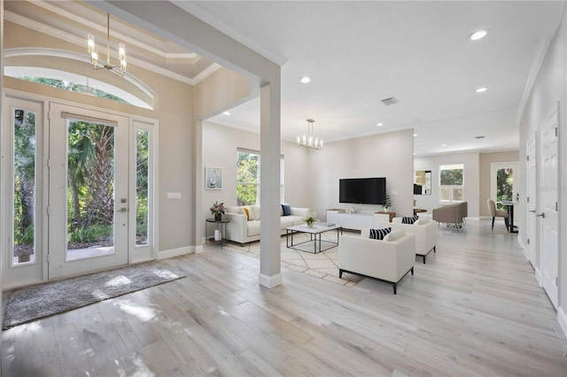 5018 Hanging Moss Ln, Sarasota, FL 34238 - foyer featuring a chandelier, recessed lighting, light wood-type flooring, and ornamental molding