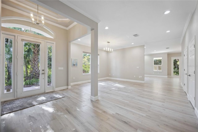 5018 Hanging Moss Ln, Sarasota, FL 34238 - foyer with a chandelier, ornamental molding, recessed lighting, and light wood-style floors