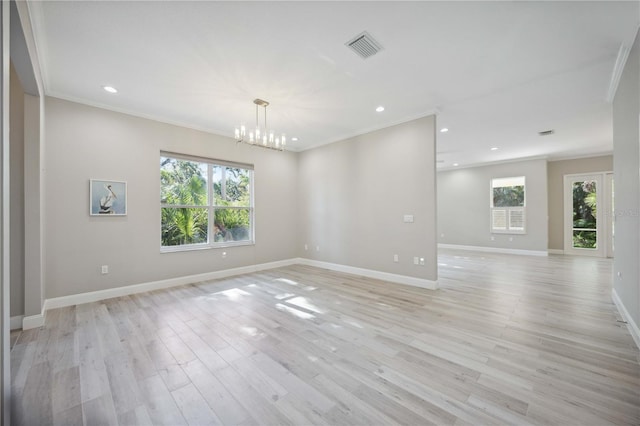 5018 Hanging Moss Ln, Sarasota, FL 34238 - empty room featuring a chandelier, ornamental molding, light wood-style floors, and recessed lighting