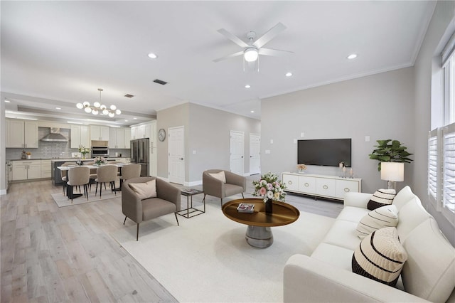 5018 Hanging Moss Ln, Sarasota, FL 34238 - living area featuring light wood-style floors, recessed lighting, ornamental molding, and a ceiling fan