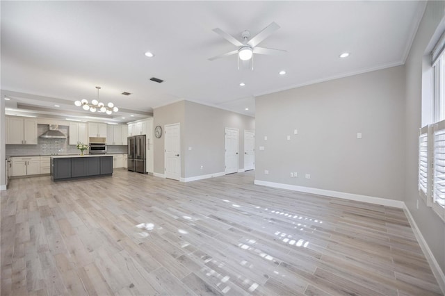 5018 Hanging Moss Ln, Sarasota, FL 34238 - unfurnished living room with ceiling fan, crown molding, recessed lighting, a chandelier, and light wood finished floors