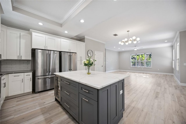 5018 Hanging Moss Ln, Sarasota, FL 34238 - kitchen featuring freestanding refrigerator, crown molding, recessed lighting, white cabinets, and light wood-style floors
