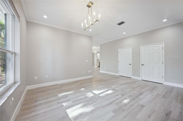 5018 Hanging Moss Ln, Sarasota, FL 34238 - spare room with a chandelier, crown molding, recessed lighting, and light wood finished floors
