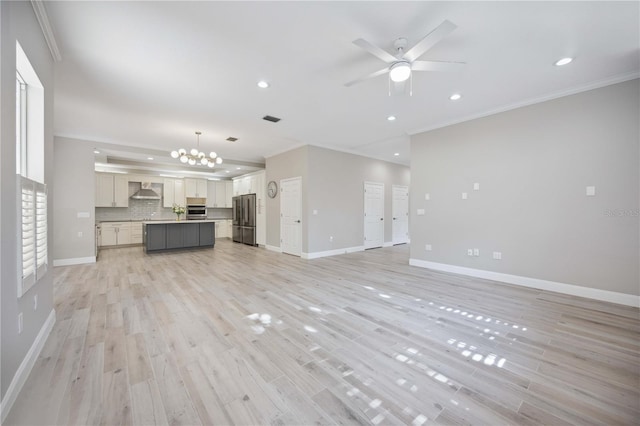 5018 Hanging Moss Ln, Sarasota, FL 34238 - unfurnished living room featuring crown molding, ceiling fan, light wood finished floors, a chandelier, and recessed lighting