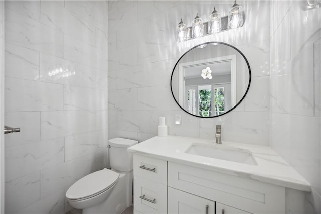 5018 Hanging Moss Ln, Sarasota, FL 34238 - bathroom featuring tile walls and vanity