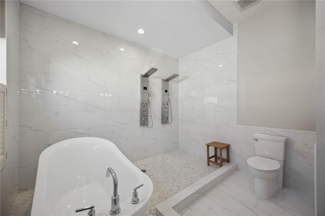 5018 Hanging Moss Ln, Sarasota, FL 34238 - bathroom with tile walls, a freestanding bath, marble finish flooring, and a shower