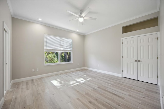 5018 Hanging Moss Ln, Sarasota, FL 34238 - unfurnished bedroom with ornamental molding, light wood finished floors, recessed lighting, ceiling fan, and a closet