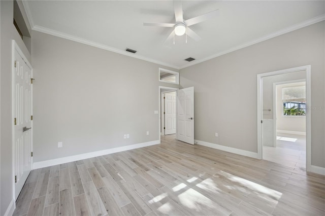 5018 Hanging Moss Ln, Sarasota, FL 34238 - unfurnished bedroom featuring crown molding, light wood-style floors, and a ceiling fan