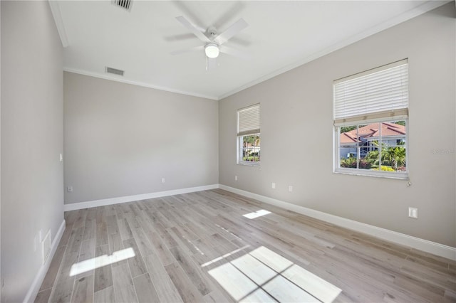 5018 Hanging Moss Ln, Sarasota, FL 34238 - empty room with crown molding, a ceiling fan, and light wood-style floors