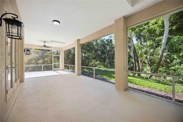 5018 Hanging Moss Ln, Sarasota, FL 34238 - unfurnished sunroom with ceiling fan and plenty of natural light