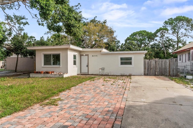 8075 48th Ave N, Saint Petersburg, FL 33709 - view of front of property with stucco siding and driveway