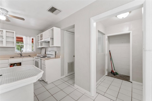 8075 48th Ave N, Saint Petersburg, FL 33709 - kitchen featuring open shelves, ceiling fan, white cabinetry, electric range, and light countertops