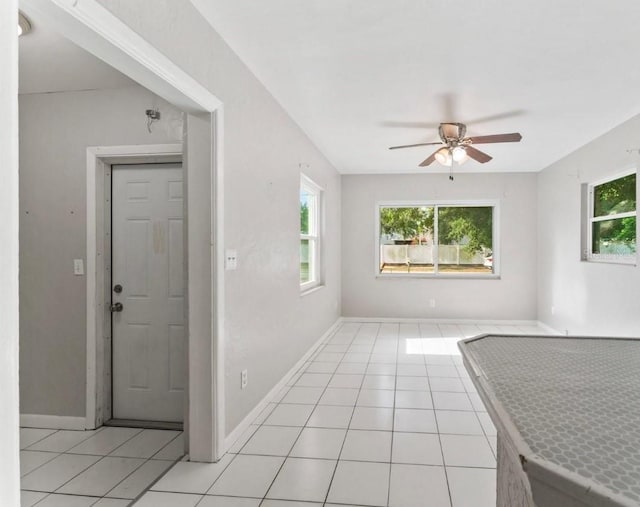 8075 48th Ave N, Saint Petersburg, FL 33709 - entrance foyer featuring a ceiling fan, plenty of natural light, and light tile patterned flooring