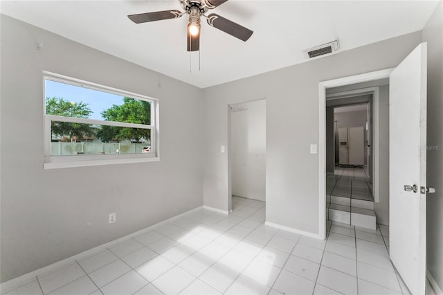 8075 48th Ave N, Saint Petersburg, FL 33709 - unfurnished bedroom with light tile patterned flooring and a ceiling fan