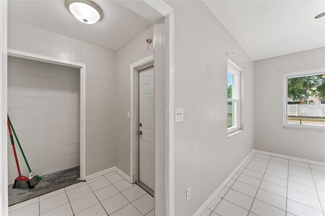 8075 48th Ave N, Saint Petersburg, FL 33709 - hall with light tile patterned floors and baseboards