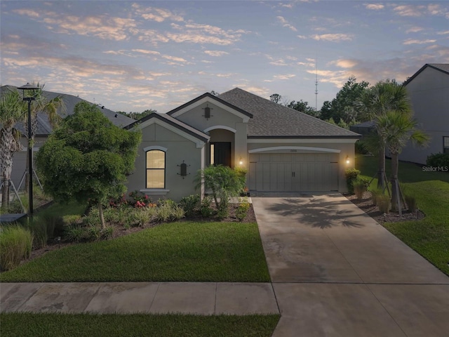 15316 Shady Palms Ln, Nokomis, FL 34275 - ranch-style home featuring an attached garage, driveway, a yard, stucco siding, and a shingled roof