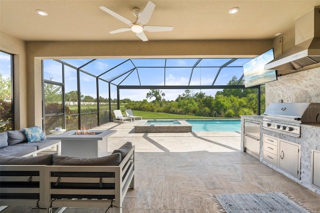 15316 Shady Palms Ln, Nokomis, FL 34275 - view of patio featuring an outdoor kitchen, an outdoor living space with a fire pit, ceiling fan, a lanai, and a pool with connected hot tub