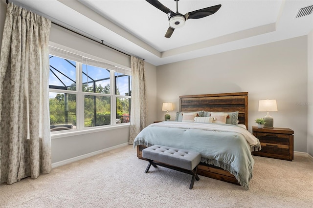 15316 Shady Palms Ln, Nokomis, FL 34275 - bedroom with carpet floors, a raised ceiling, and ceiling fan