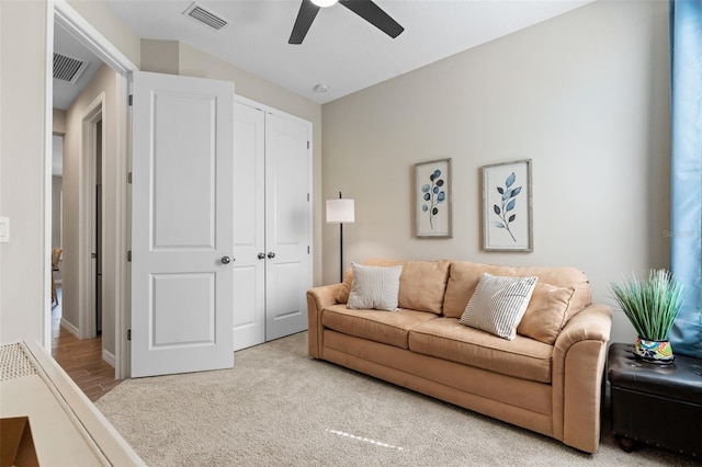 15316 Shady Palms Ln, Nokomis, FL 34275 - living room with a ceiling fan and light colored carpet