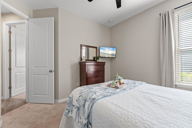 15316 Shady Palms Ln, Nokomis, FL 34275 - carpeted bedroom with baseboards and ceiling fan