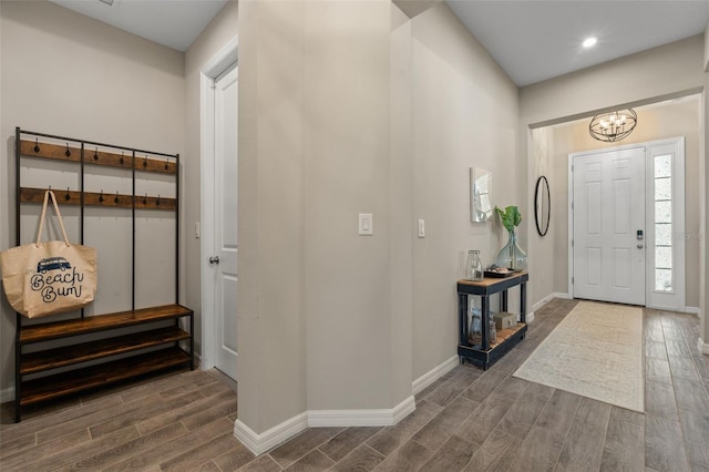 15316 Shady Palms Ln, Nokomis, FL 34275 - foyer entrance featuring wood tiled floors, a chandelier, and recessed lighting
