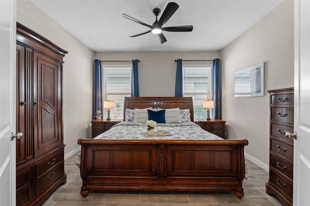 15316 Shady Palms Ln, Nokomis, FL 34275 - bedroom with baseboards and a ceiling fan