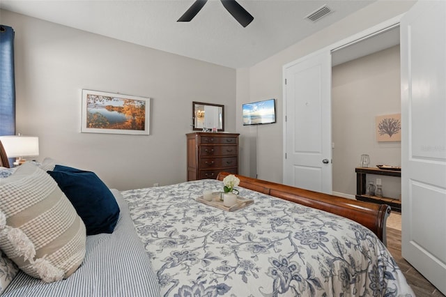 15316 Shady Palms Ln, Nokomis, FL 34275 - bedroom featuring ceiling fan and wood finished floors