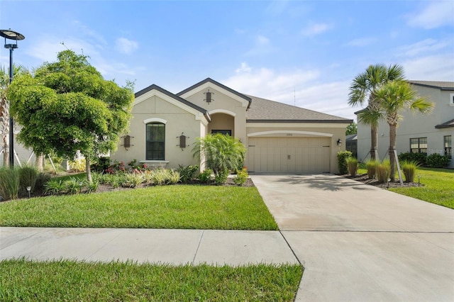 15316 Shady Palms Ln, Nokomis, FL 34275 - view of front of property with stucco siding, a garage, concrete driveway, and a front lawn