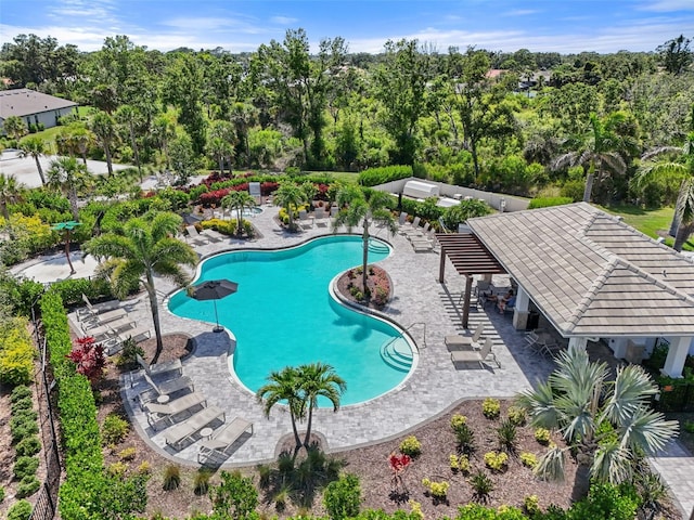 15316 Shady Palms Ln, Nokomis, FL 34275 - community pool with a patio area and view of wooded area