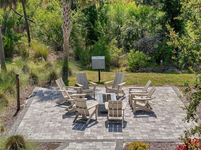 15316 Shady Palms Ln, Nokomis, FL 34275 - view of patio with an outdoor fire pit