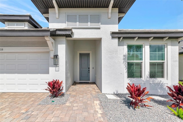 17333 Savory Mist Cir, Bradenton, FL 34211 - entrance to property with stucco siding and an attached garage