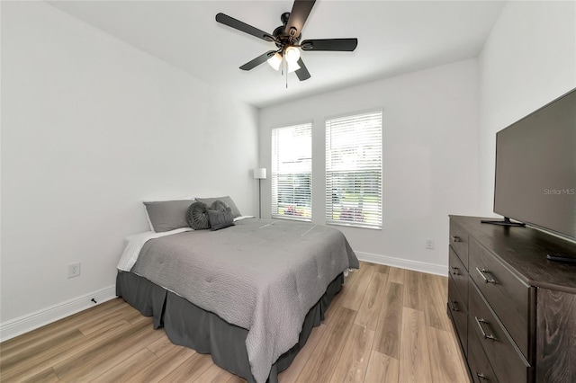 17333 Savory Mist Cir, Bradenton, FL 34211 - bedroom with light wood finished floors, baseboards, and ceiling fan