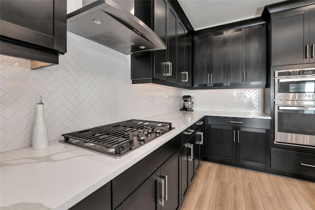 17333 Savory Mist Cir, Bradenton, FL 34211 - kitchen with island range hood, appliances with stainless steel finishes, and tasteful backsplash