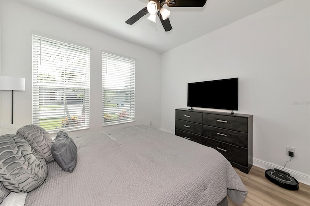 17333 Savory Mist Cir, Bradenton, FL 34211 - bedroom with light wood-style floors, baseboards, and ceiling fan