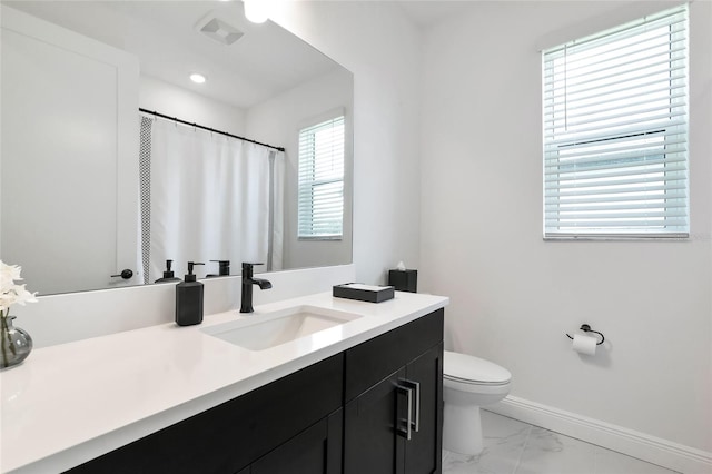 17333 Savory Mist Cir, Bradenton, FL 34211 - full bathroom featuring marble finish flooring, baseboards, toilet, vanity, and a shower with shower curtain
