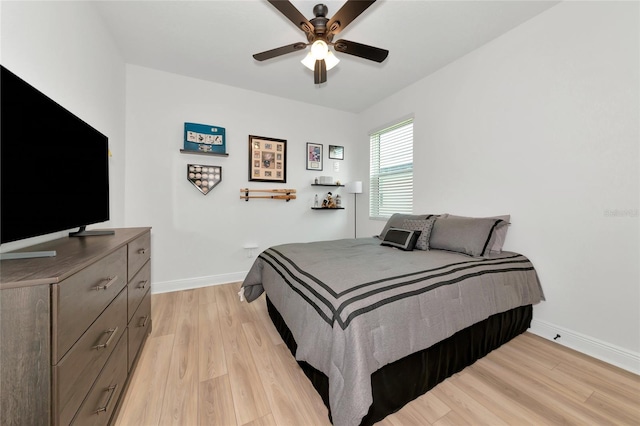 17333 Savory Mist Cir, Bradenton, FL 34211 - bedroom with light wood-style flooring, baseboards, and a ceiling fan