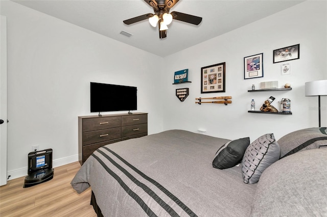 17333 Savory Mist Cir, Bradenton, FL 34211 - bedroom with light wood-type flooring, baseboards, and a ceiling fan