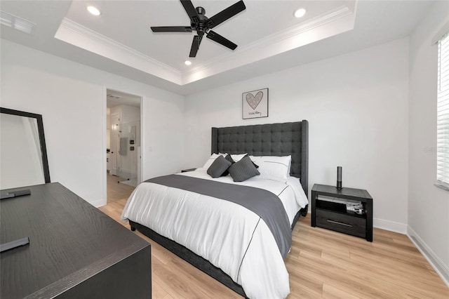 17333 Savory Mist Cir, Bradenton, FL 34211 - bedroom with a tray ceiling, recessed lighting, light wood-type flooring, ornamental molding, and baseboards