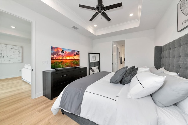 17333 Savory Mist Cir, Bradenton, FL 34211 - bedroom featuring light wood-style floors, a tray ceiling, recessed lighting, ornamental molding, and a ceiling fan